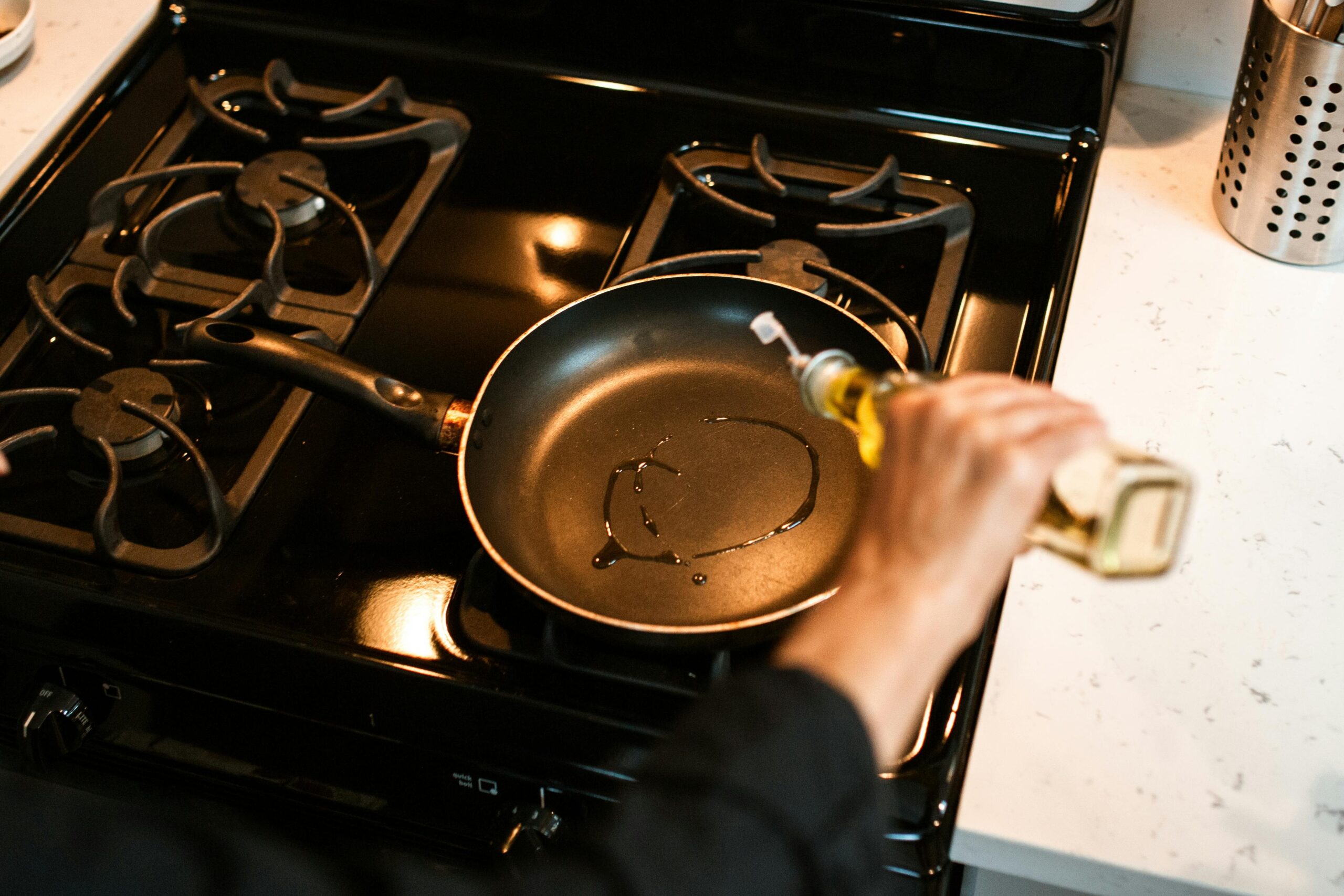 chef cooking with oil